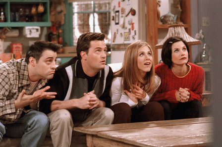 A Scene From The Movie Friends Sitting On A Sofa And Watching Tv Together