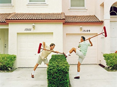 Neighbours Argueing With Brooms